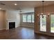 Bright living room with fireplace, ceiling fan and access to the outdoor patio at 2405 Malster Ln, Lawrenceville, GA 30043