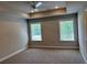 Spacious main bedroom with ample natural light and neutral color palette at 2405 Malster Ln, Lawrenceville, GA 30043