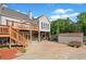 View of the backyard with a deck, stairs, a storage shed and lawn equipment at 675 Jack Page Ln, Canton, GA 30115