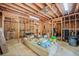 Large unfinished basement with exposed ceiling and wooden framing, great potential at 675 Jack Page Ln, Canton, GA 30115
