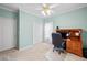 Cozy bedroom featuring a ceiling fan, an office nook, and a closet at 675 Jack Page Ln, Canton, GA 30115