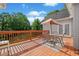 View of the deck furnished with a table, chairs, and an umbrella at 675 Jack Page Ln, Canton, GA 30115