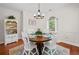 A well-decorated dining room is illuminated by a modern chandelier at 675 Jack Page Ln, Canton, GA 30115