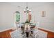 A well-decorated dining room is illuminated by a modern chandelier at 675 Jack Page Ln, Canton, GA 30115