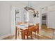 Bright dining room with natural light, wooden table and access to the laundry room at 675 Jack Page Ln, Canton, GA 30115