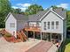 Rear exterior of home, featuring a deck, stairs and a ground level storage area at 675 Jack Page Ln, Canton, GA 30115