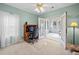 Bright home office with a large window and French doors leading to a sunroom at 675 Jack Page Ln, Canton, GA 30115