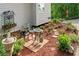 Serene landscaping with seating, bird feeders and lush flowers at 675 Jack Page Ln, Canton, GA 30115
