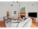 Open living room with hardwood floors, fireplace and large windows providing lots of natural light at 675 Jack Page Ln, Canton, GA 30115