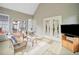 Bright sunroom with neutral decor, French doors, and patio access for relaxing and entertaining at 675 Jack Page Ln, Canton, GA 30115