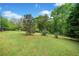Expansive lawn with mature trees at 675 Jack Page Ln, Canton, GA 30115