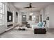 Bright, open-concept living room featuring a fireplace, modern furnishings, and large windows at 995 Sw Sparks St, Atlanta, GA 30310