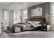 Luxurious bedroom with stylish accent wall, modern lighting, and ample natural light at 995 Sw Sparks St, Atlanta, GA 30310