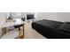 A small bedroom features a desk and bed setup, perfect for a student or a minimalist lifestyle at 1025 Cherryfield Run, Marietta, GA 30008