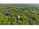 Distant aerial view of the home, surrounded by the lush trees at 1255 Cold Harbor Dr, Roswell, GA 30075