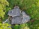 Aerial view of a home with pool, deck, and lush landscaping at 1255 Cold Harbor Dr, Roswell, GA 30075