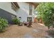 Landscaped backyard featuring a firepit, a stone walkway, and lush greenery at 1255 Cold Harbor Dr, Roswell, GA 30075