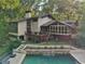 Backyard with private pool, deck, and screened-in porch, perfect for outdoor living at 1255 Cold Harbor Dr, Roswell, GA 30075