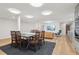 Finished basement featuring an open floor plan with dining and living area at 1255 Cold Harbor Dr, Roswell, GA 30075