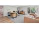 Finished basement with a desk, wood style flooring and a light-colored couch at 1255 Cold Harbor Dr, Roswell, GA 30075