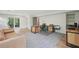 Finished basement with multiple workstations and an exit to the backyard at 1255 Cold Harbor Dr, Roswell, GA 30075
