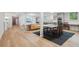 Finished basement with open floor plan, dining area, and modern kitchenette at 1255 Cold Harbor Dr, Roswell, GA 30075