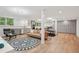 Finished basement with a sleek kitchenette, living area, and custom storage cabinets at 1255 Cold Harbor Dr, Roswell, GA 30075