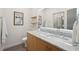 Modern bathroom featuring a bright LED mirror over a granite countertop at 1255 Cold Harbor Dr, Roswell, GA 30075