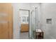 Modern bathroom featuring tiled shower with a glass door and built-in bench seating at 1255 Cold Harbor Dr, Roswell, GA 30075