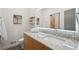 Modern bathroom featuring a bright LED mirror over a granite countertop and stylish fixtures at 1255 Cold Harbor Dr, Roswell, GA 30075