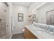 Modern bathroom featuring a tiled shower with glass door and bright LED mirror at 1255 Cold Harbor Dr, Roswell, GA 30075