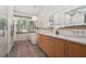 Bright bathroom featuring double vanity, soaking tub, and glass shower with modern finishes and stylish decor at 1255 Cold Harbor Dr, Roswell, GA 30075