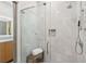 Modern bathroom featuring a tiled shower with glass door and rain shower head at 1255 Cold Harbor Dr, Roswell, GA 30075