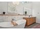 Elegant bathroom featuring a soaking tub, wooden vanity, and a modern design for a spa-like experience at 1255 Cold Harbor Dr, Roswell, GA 30075