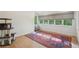 Versatile room featuring natural light from large windows and wood floors, perfect for a bedroom or flex space at 1255 Cold Harbor Dr, Roswell, GA 30075