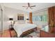 Cozy bedroom with ceiling fan, hardwood floors, and neutral decor at 1255 Cold Harbor Dr, Roswell, GA 30075