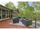 Outdoor deck with patio furniture and views overlooking the forest and pool at 1255 Cold Harbor Dr, Roswell, GA 30075