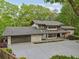 Modern two-story home with expansive driveway and beautifully landscaped front yard at 1255 Cold Harbor Dr, Roswell, GA 30075