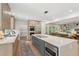 Bright kitchen features a large island with modern appliances and quartz countertops at 1255 Cold Harbor Dr, Roswell, GA 30075