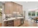 Charming kitchen wet bar includes built-in wine and beverage coolers with stone countertops at 1255 Cold Harbor Dr, Roswell, GA 30075