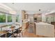 Charming kitchen with modern appliances, stone island, and breakfast nook with exterior views at 1255 Cold Harbor Dr, Roswell, GA 30075