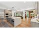 Open concept kitchen featuring stainless appliances and an eat-in center island at 1255 Cold Harbor Dr, Roswell, GA 30075
