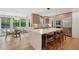 Modern kitchen with stainless steel appliances, large center island, and breakfast nook by expansive windows at 1255 Cold Harbor Dr, Roswell, GA 30075