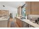 Spacious kitchen with stone countertops, stainless appliances, and modern backsplash at 1255 Cold Harbor Dr, Roswell, GA 30075