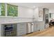 Basement kitchenette featuring granite counters, modern appliances, and beverage cooler at 1255 Cold Harbor Dr, Roswell, GA 30075