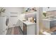 Laundry room with stainless appliances, built in utility sink, and countertop space at 1255 Cold Harbor Dr, Roswell, GA 30075