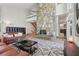 Spacious living room with stone fireplace, stylish decor, and access to other rooms at 1255 Cold Harbor Dr, Roswell, GA 30075