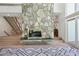 Large living room with stone fireplace and stairs to a second floor with a view through sliding doors at 1255 Cold Harbor Dr, Roswell, GA 30075