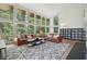 Sun-filled living room with hardwood floors, multiple windows, and modern decor at 1255 Cold Harbor Dr, Roswell, GA 30075