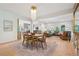 Bright open concept living space with hardwood floors, modern furniture, and a stone accent wall at 1255 Cold Harbor Dr, Roswell, GA 30075